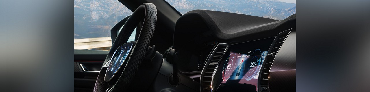 headerimage-copy.jpg：自動車のステアリングホイールの写真