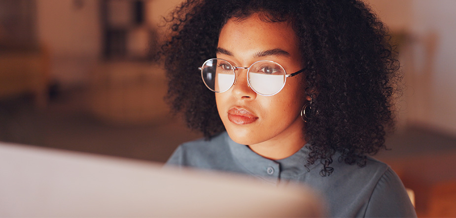 Woman sitting looking at monitor